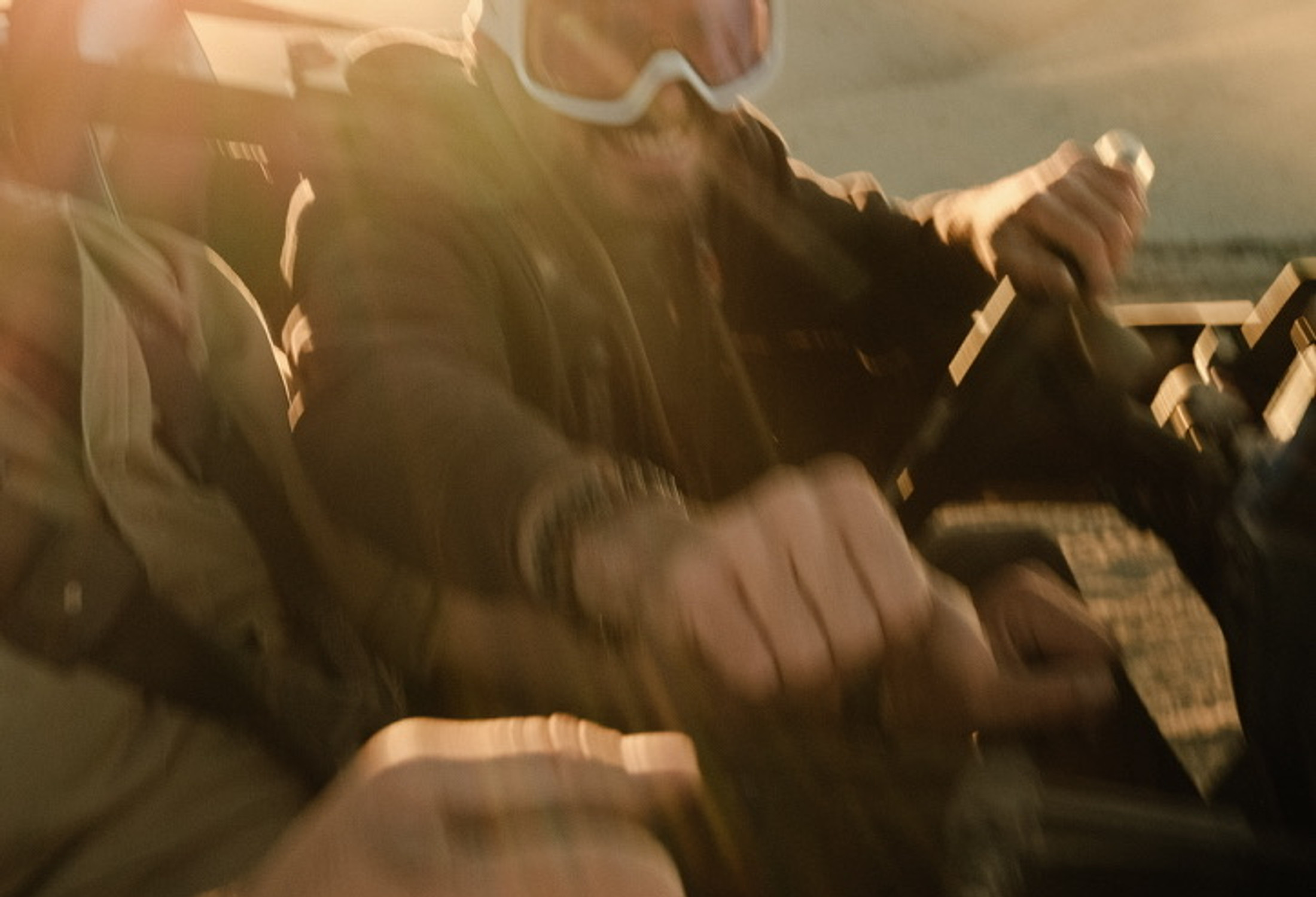 Film frame · riders in a UTV at golden hour, motion blur