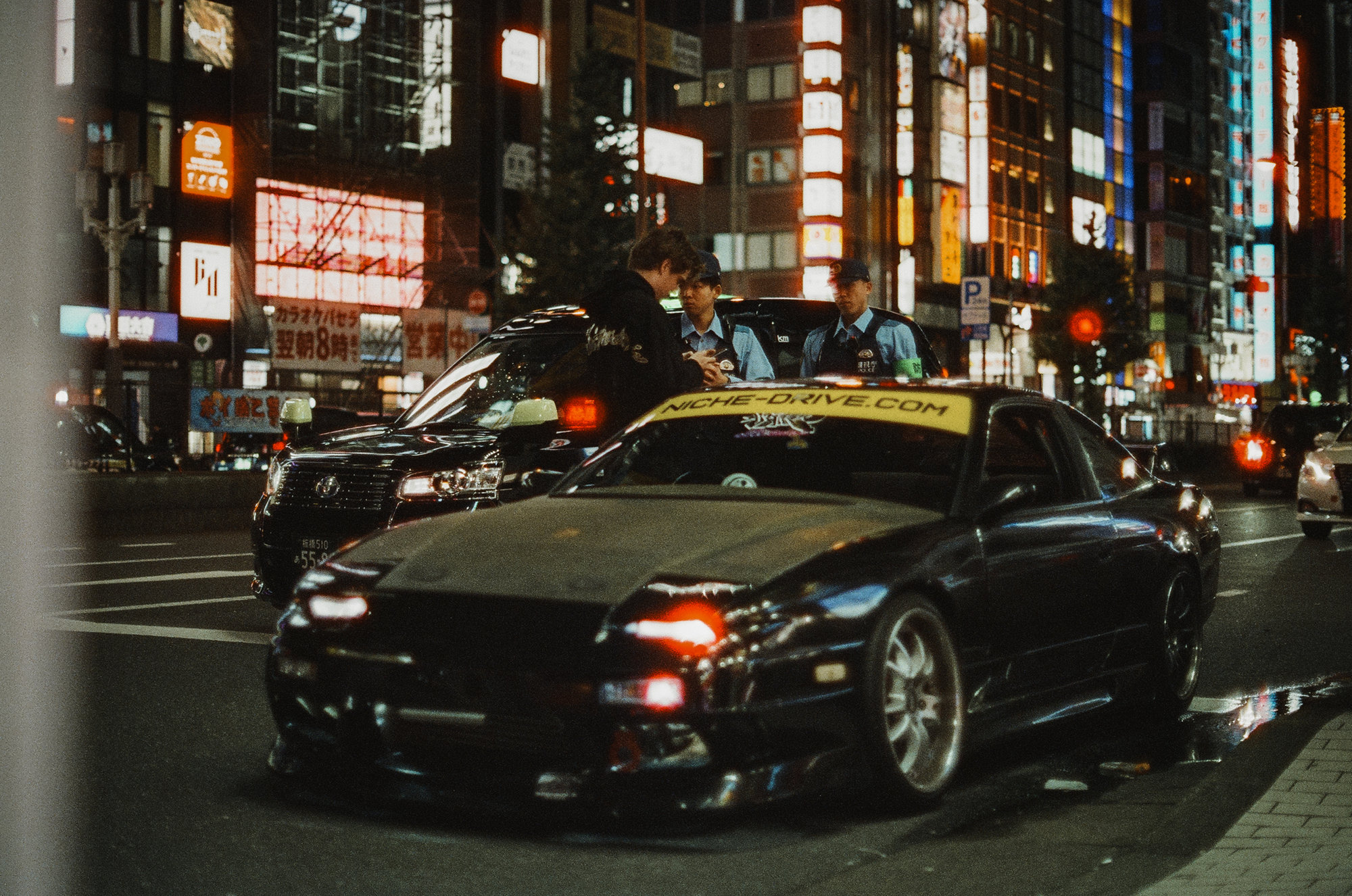 Nissan 180SX under Shinjuku neon at night · Japan on 35mm film